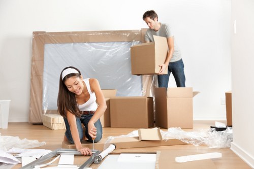 Professional removal team loading furniture in Harmondsworth