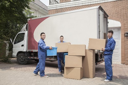 Experienced packers handling fragile household items in Harmondsworth