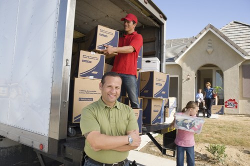 Packed moving boxes and furniture ready for transport